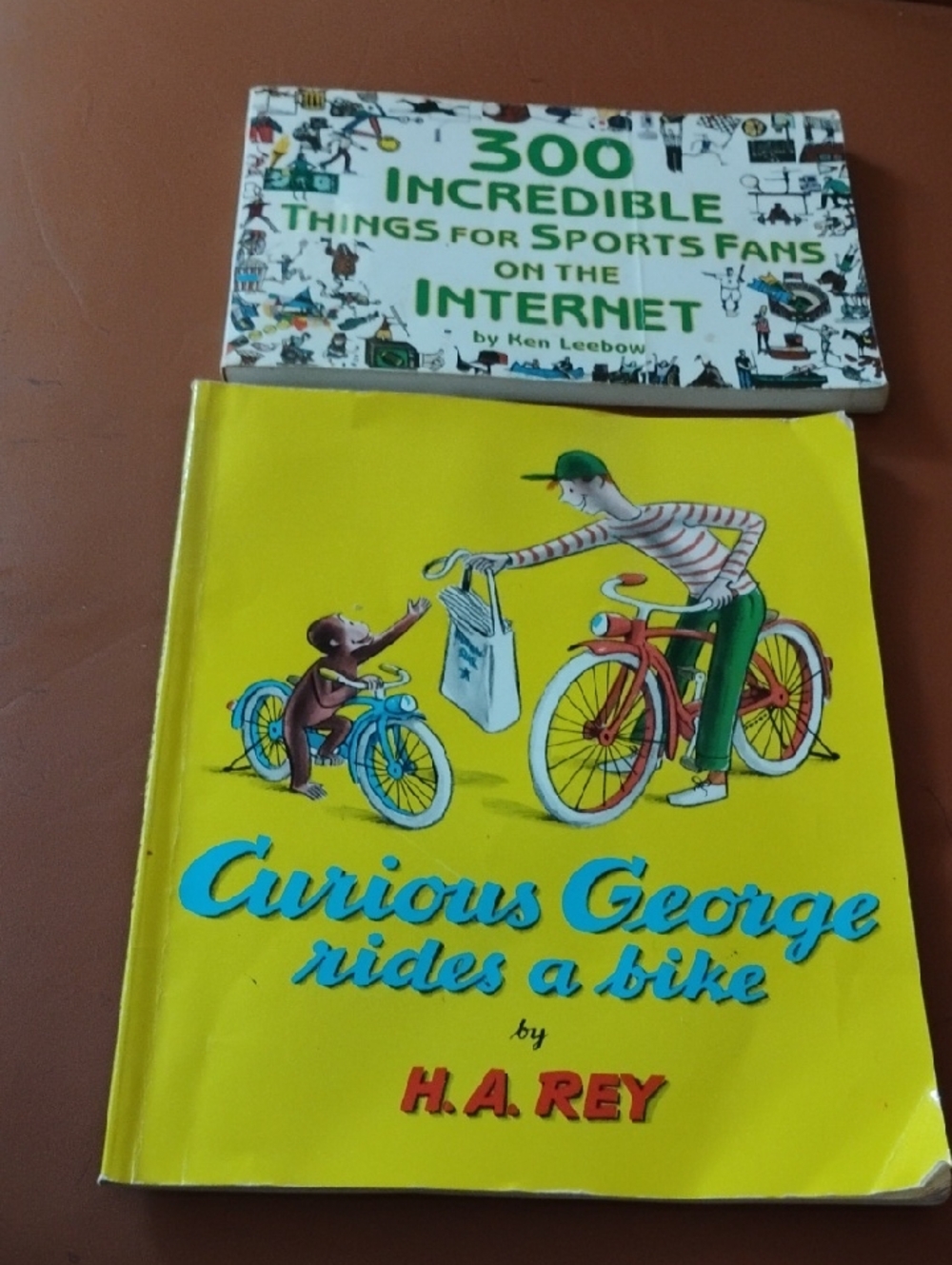 Curious George Rides a Bike by H.A. Rey - Yellow Hardcover Kids Book